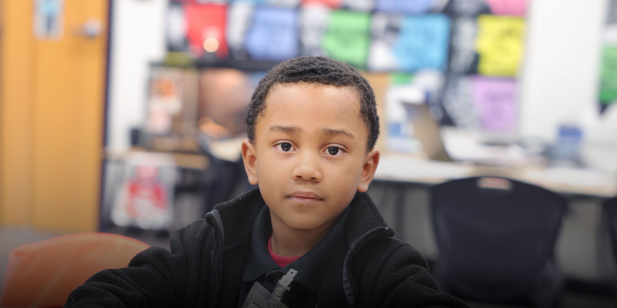 Elementary student sitting in class